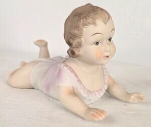Vtg UCGC Bisque Porcelain Piano Baby Girl Crawling Figurine 5 1/2" Tall 9" Long